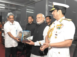 The Prime Minister, Shri Narendra Modi being presented a memento by the Union Minister for Defence, Shri Manohar Parrikar, at the International Fleet Review-2016, at Visakhapatnam on February 07, 2016. The Governor of Andhra Pradesh and Telangana, Shri E.S.L. Narasimhan and the Chief of Naval Staff, Admiral R.K. Dhowan are also seen.