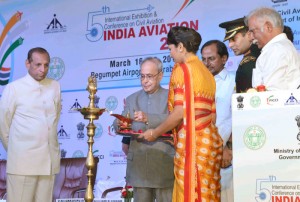 The President, Shri Pranab Mukherjee lighting the lamp to inaugurate the 5th Edition of Binennial Aviation Event on the theme 'India's Civil Aviation Sector: Potential a Global Manufacturing & MRO Hub', at Hyderabad on March 16, 2016. The Governor of Andhra Pradesh and Telangana, Shri E.S.L. Narasimhan the Union Minister for Civil Aviation, Shri Ashok Gajapathi Raju Pusapati and the Chief Minister of Telangana, Shri K. Chandrashekar Rao are also seen.